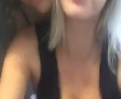 Caroline Vreeland playing piano with friend, cleavage from piano nude